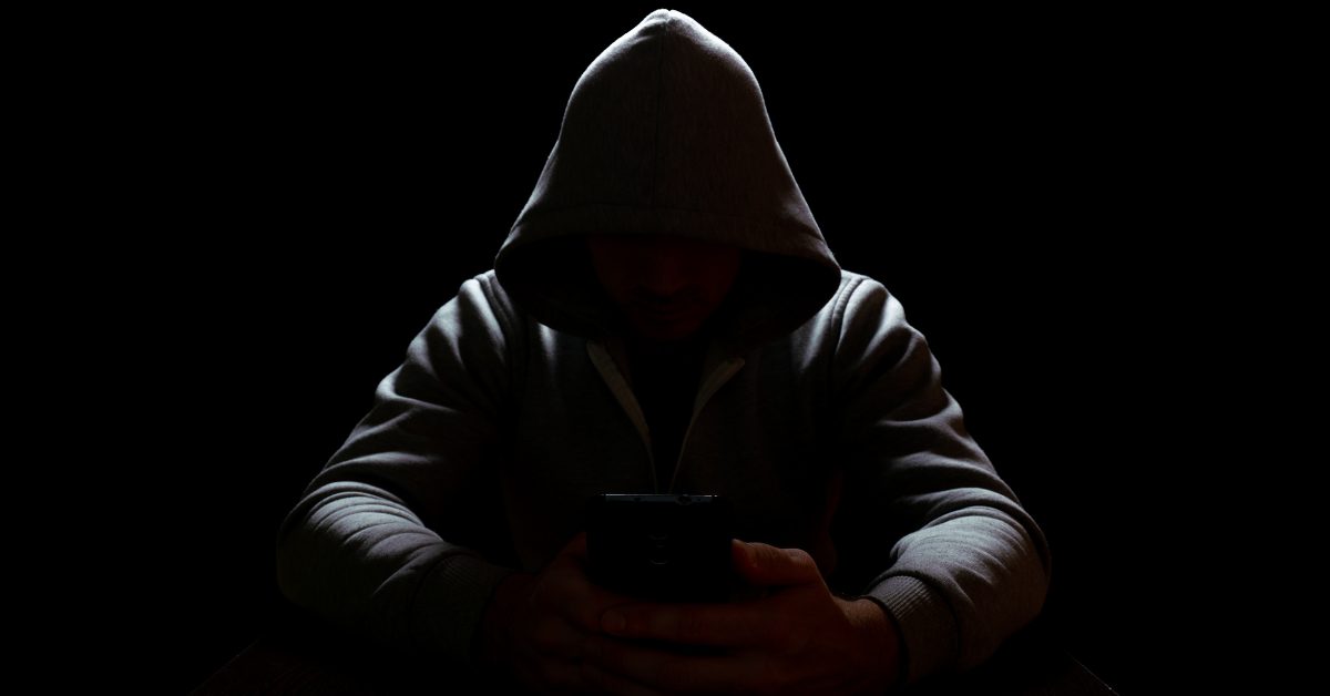 A person seeking legal help after being targeted by online sextortion, with Joe Cunningham Law offering confidential support.